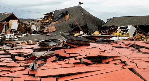 Storm restoration experts assessing property damage after heavy rain